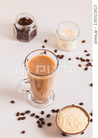 Protein coffee proffee for the morning ritual in a glass on the table vertical view 138321617