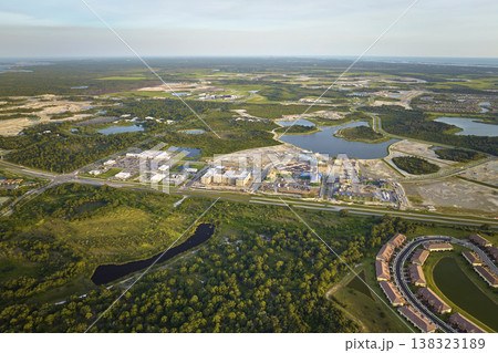 Aerial view of construction site with new tightly packed homes in Florida closed living clubs. Family houses as example of real estate development in american suburbs 138323189