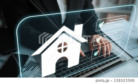Hand of a Businessperson Using Laptop with Home Symbol to Represent Real Estate Management and Online Property Transactions in a Modern Office Environment Gluon Hand of a Businessperson Using Laptop with Home Symbol to Represent Real Estate Management and Online Property Transactions in a Modern Office Environment Gluon 138323500