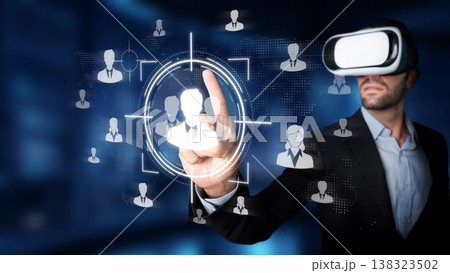 Explore the innovative fusion of business and virtual reality as a professional immerses in advanced technology to create interactive experiences and enhance engagement. Sigmoid 138323502