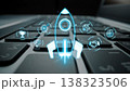 This image features a futuristic rocket launch icon hovering above a laptop keyboard, symbolizing innovation and growth in the digital business landscape. Ideal for tech and startup themes. Sigmoid 138323506