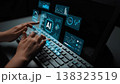 Hands Typing on Keyboard with AI Data Visualization Overlay on Computer Screen in a Dark Room Gluon 138323519