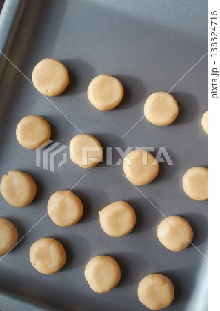 Unbaked Cookie Dough Balls on Baking Sheet 138324716