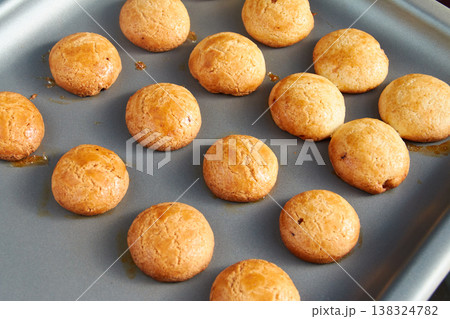 Freshly Baked Golden Round Cookies on a Baking Sheet Freshly Baked Golden Round Cookies on a Baking Sheet 138324782