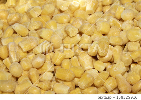 Cose up of frozen sweetcorn corn kernels yellow seeds background 138325916