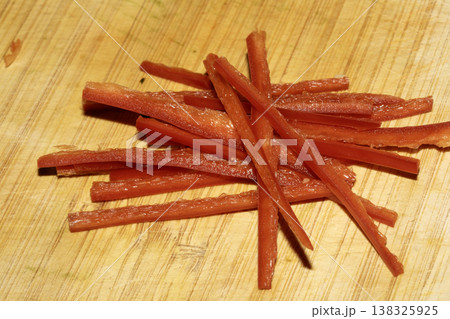 Close up of chopped chili salad vegetables on a wooden chopping board Close up of chopped chili salad vegetables on a wooden chopping board 138325925