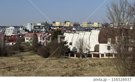 View of residential area in Prague with buildings under clear sky and trees in spring season View of residential area in Prague with buildings under clear sky and trees in spring season 138326037