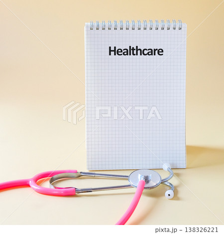 Healthcare words on notepad .Insurance, Wellness and medical concept. Healthcare words on notepad .Insurance, Wellness and medical concept. 138326221