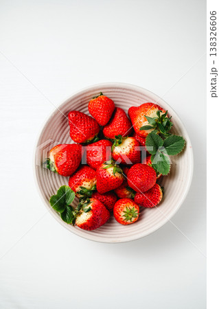 Strawberry red berry fruits in a bowl, isolated, abstract food background, top view Strawberry red berry fruits in a bowl, isolated, abstract food background, top view 138326606
