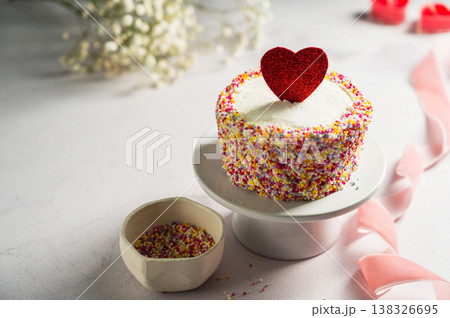 Valentine's Day, Love, festive cake with red heart and gypsophila flowers 138326695