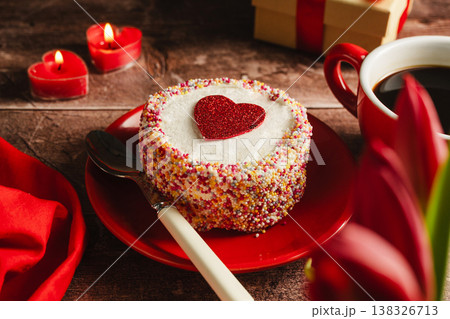 Valentine's Day background. Cake with red heart, candles, gift box and cup of coffee on table. Love celebration 138326713