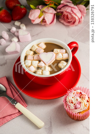 Valentine's Day background. Red cup of coffee with heart shaped marshmallows and ret tulips 138326791