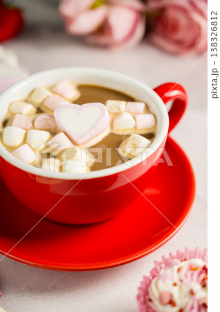 Valentine's Day background. Red cup of coffee with heart shaped marshmallows and ret tulips 138326812