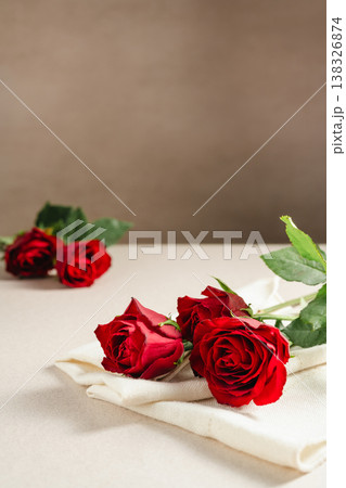 Mother's Day or Valentine's Day background. Red rose flowers on neutral background. Greeting card template, copy space 138326874