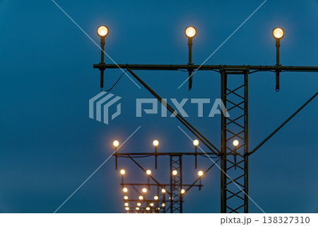 Airport approach lighting system at dusk 138327310
