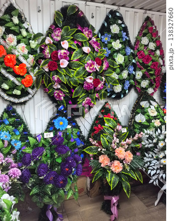 Colorful funeral wreaths adorned with vibrant flowers for mourning occasions Colorful funeral wreaths adorned with vibrant flowers for mourning occasions 138327660
