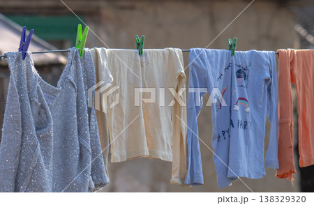 washed items drying on a wire washed items drying on a wire 138329320