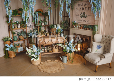 Provence style living room design with hanging flowers and wooden furniture Provence style living room design with hanging flowers and wooden furniture 138329847