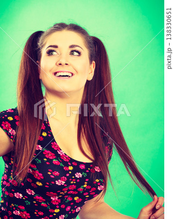 Happy teenager girl with ponytails Happy teenager girl with ponytails 138330651