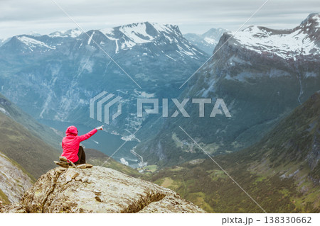 Tourist woman on Dalsnibba viewpoint Norway Tourist woman on Dalsnibba viewpoint Norway 138330662
