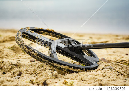 metal detector on sea beach metal detector on sea beach 138330791