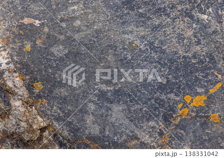 Rugged rock covered with lichen in natural outdoor setting Rugged rock covered with lichen in natural outdoor setting 138331042