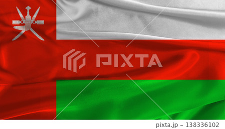 Flag of Oman with fabric textured background. Close up of National flag of Oman with realistic texture Flag of Oman with fabric textured background. Close up of National flag of Oman with realistic texture 138336102