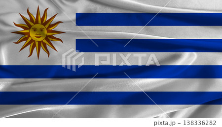 Flag of Uruguay with fabric textured background. Close up of National flag of Uruguay with realistic texture Flag of Uruguay with fabric textured background. Close up of National flag of Uruguay with realistic texture 138336282