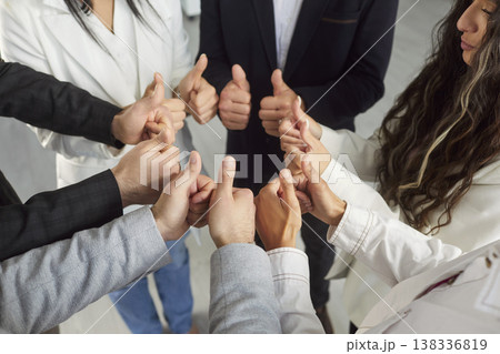Group of businesspeople showing thumbs-up gesture, close-up Group of businesspeople showing thumbs-up gesture, close-up 138336819
