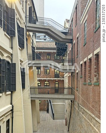Historic architecture with external staircases and brick buildings in an urban setting 138337203