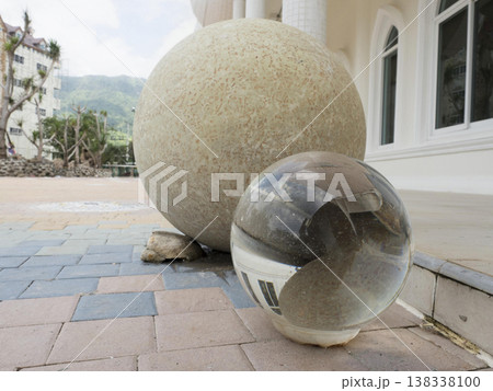 Large stone sphere outdoor clear glass sphere reflection modern architecture detail Large stone sphere outdoor clear glass sphere reflection modern architecture detail 138338100