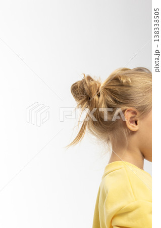 Portrait of beautiful cute little toddler girl. Child with funny face in yellow sweatshirt. Pretty smile kid in studio on white background. High quality photo Portrait of beautiful cute little toddler girl. Child with funny face in yellow sweatshirt. Pretty smile kid in studio on white background. High quality photo 138338505