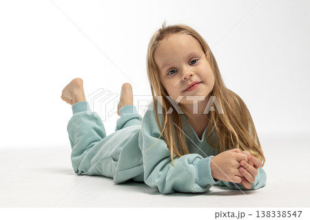 Portrait of beautiful cute little toddler girl. Child with funny face. Pretty smile kid in studio on white background. High quality photo 138338547
