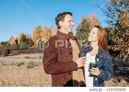 Happy beautiful couple in love enjoying autumn picnic in park. Weekend and lifestyle concept. High quality photo 138338846