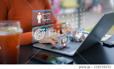 Business planning and schedule management.Digital calendar and task management.Remote work and project planning.Online appointment scheduling icons.Professional woman working at cafe. Business planning and schedule management.Digital calendar and task management.Remote work and project planning.Online appointment scheduling icons.Professional woman working at cafe. 138339252