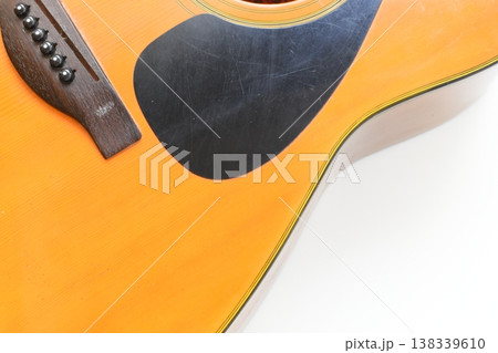 part of brown wood acoustic guitar isolated on white background part of brown wood acoustic guitar isolated on white background 138339610