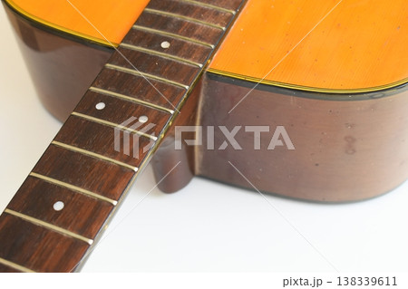 brown wood acoustic guitar isolated on white background brown wood acoustic guitar isolated on white background 138339611
