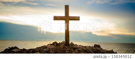 The cross standing on meadow sunset and bokeh background. 138343012