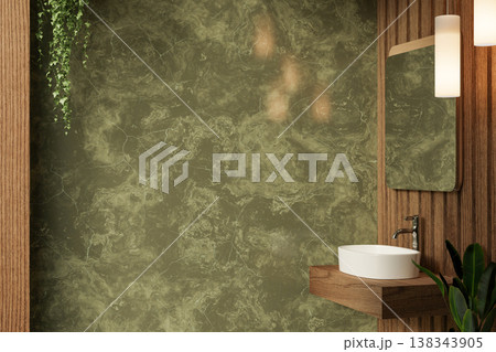 Mirror and lamp over wooden sink counter and hanging plant on green marble wall in a modern bathroom Mirror and lamp over wooden sink counter and hanging plant on green marble wall in a modern bathroom 138343905