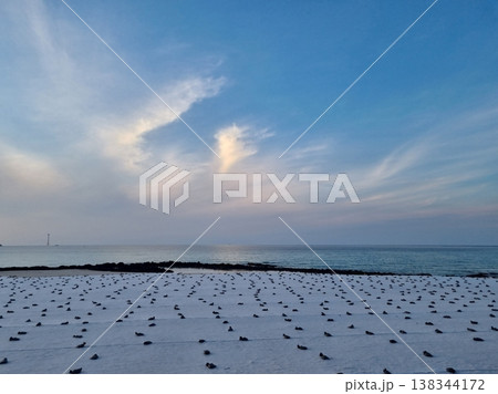 An evening beach with sandbags on it. An evening beach with sandbags on it. 138344172