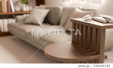 Eyeglasses and pencil on book on layered wooden shelf aside grey sofa couch in living room or lounge Eyeglasses and pencil on book on layered wooden shelf aside grey sofa couch in living room or lounge 138344195