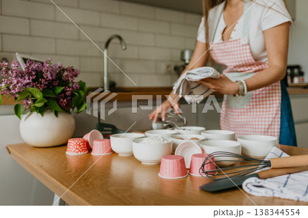 Young woman knead dough at kitchen, homemade bakery making Young woman knead dough at kitchen, homemade bakery making 138344554