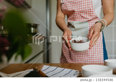 woman preparing a chocolate dessert. woman preparing a chocolate dessert. 138344586