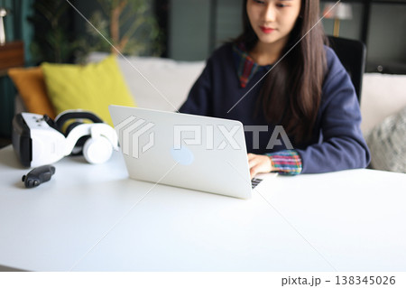Women working with laptop and VR headsets. Women working with laptop and VR headsets. 138345026