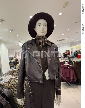 Fashion mannequin leather jacket clothing store retail display interior 138346044