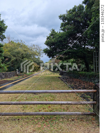 The entrance to the park is blocked by a wooden pillar. The entrance to the park is blocked by a wooden pillar. 138346272