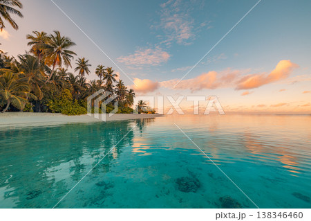 Amazing dream sunset and sunrise beach with tropical island paradise, palm trees, tranquil ocean water, and peaceful scenic coast background Amazing dream sunset and sunrise beach with tropical island paradise, palm trees, tranquil ocean water, and peaceful scenic coast background 138346460
