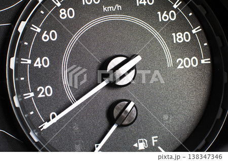 Car speedometer dashboard featuring a speedometer in km/h. 138347346