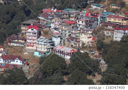Shimla Town Aerial ViewCluster of colorful houses on steep slopes in Shimla, showing dense hillside settlement and mountainous terrain. 138347400