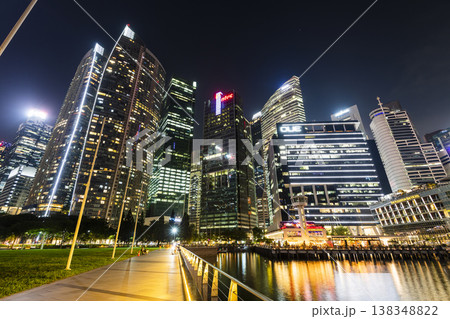Night view of the Marina Bay Financial Centre and the Raffles Place modern office skyscrapers along Marina Bay in Singapore. Night view of the Marina Bay Financial Centre and the Raffles Place modern office skyscrapers along Marina Bay in Singapore. 138348822
